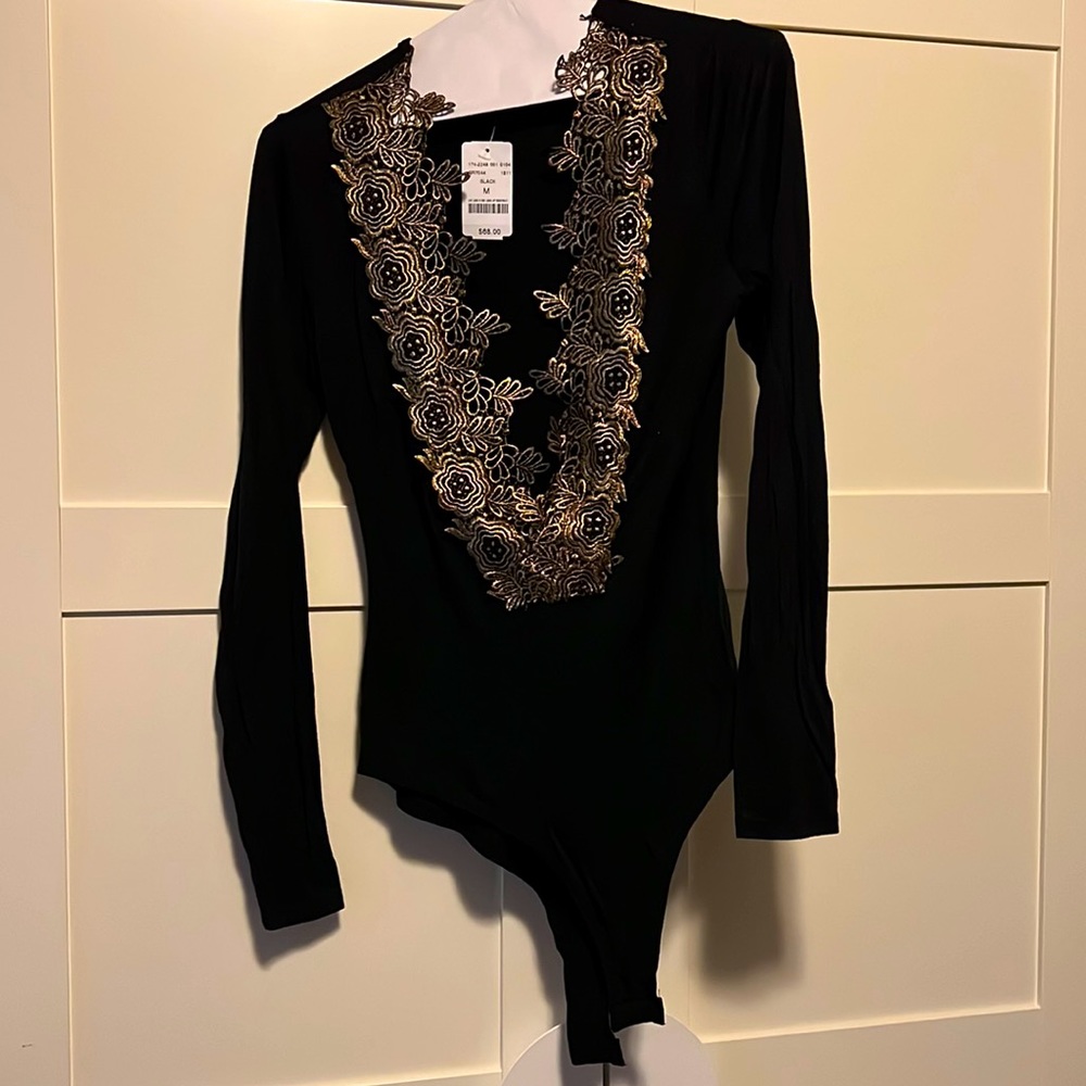 A3 design black and gold bodysuit size medium NWT